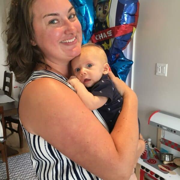 Carly Ainley Bebo Mia Student holding a baby
